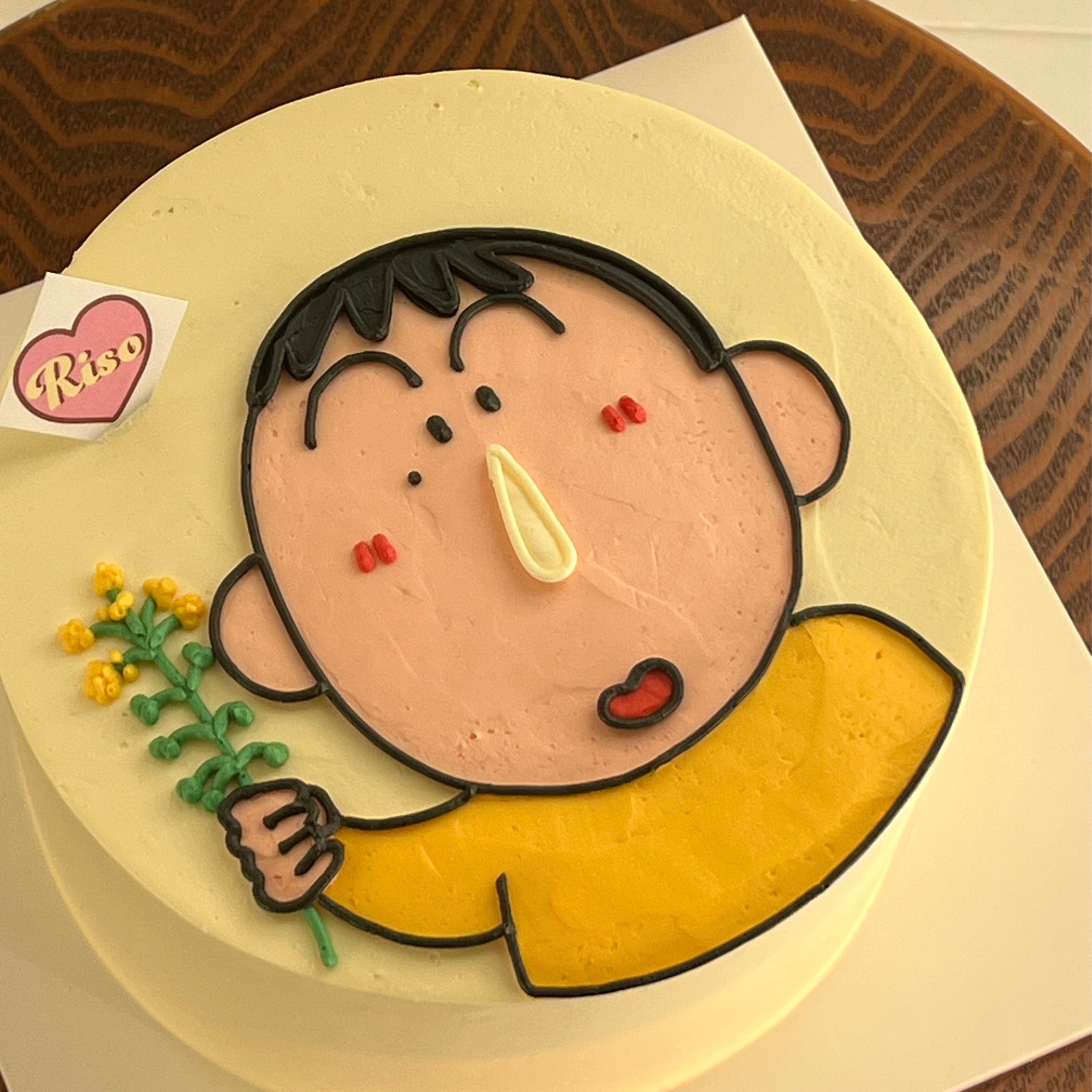 Warm-toned cartoon cake with a nostalgic vibe, showing Bo holding a tiny yellow flower — sweet and playful
