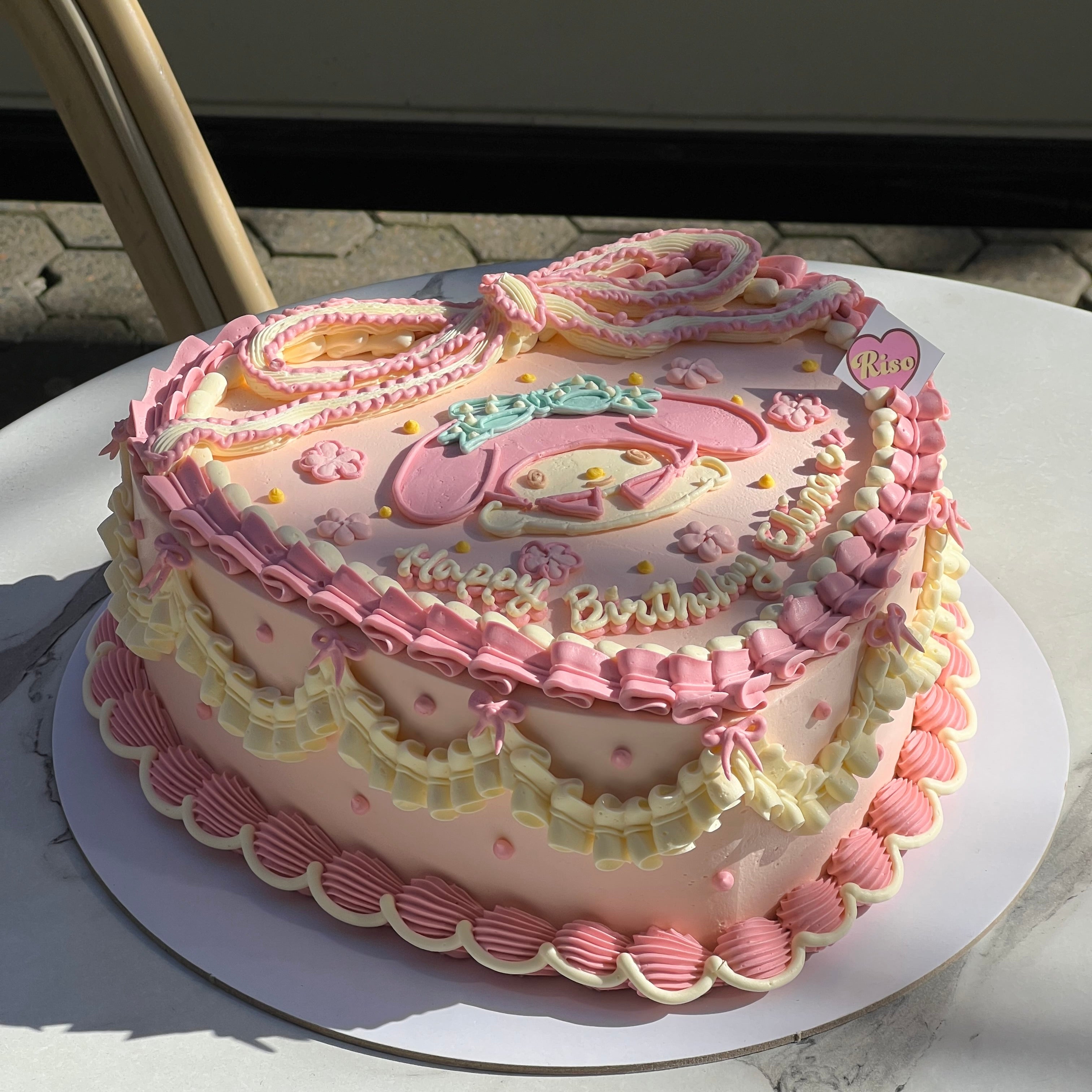 A sweet and nostalgic cake design with elegant piping and a big buttercream bow — capturing the dreamy, princess-core My Melody vibe