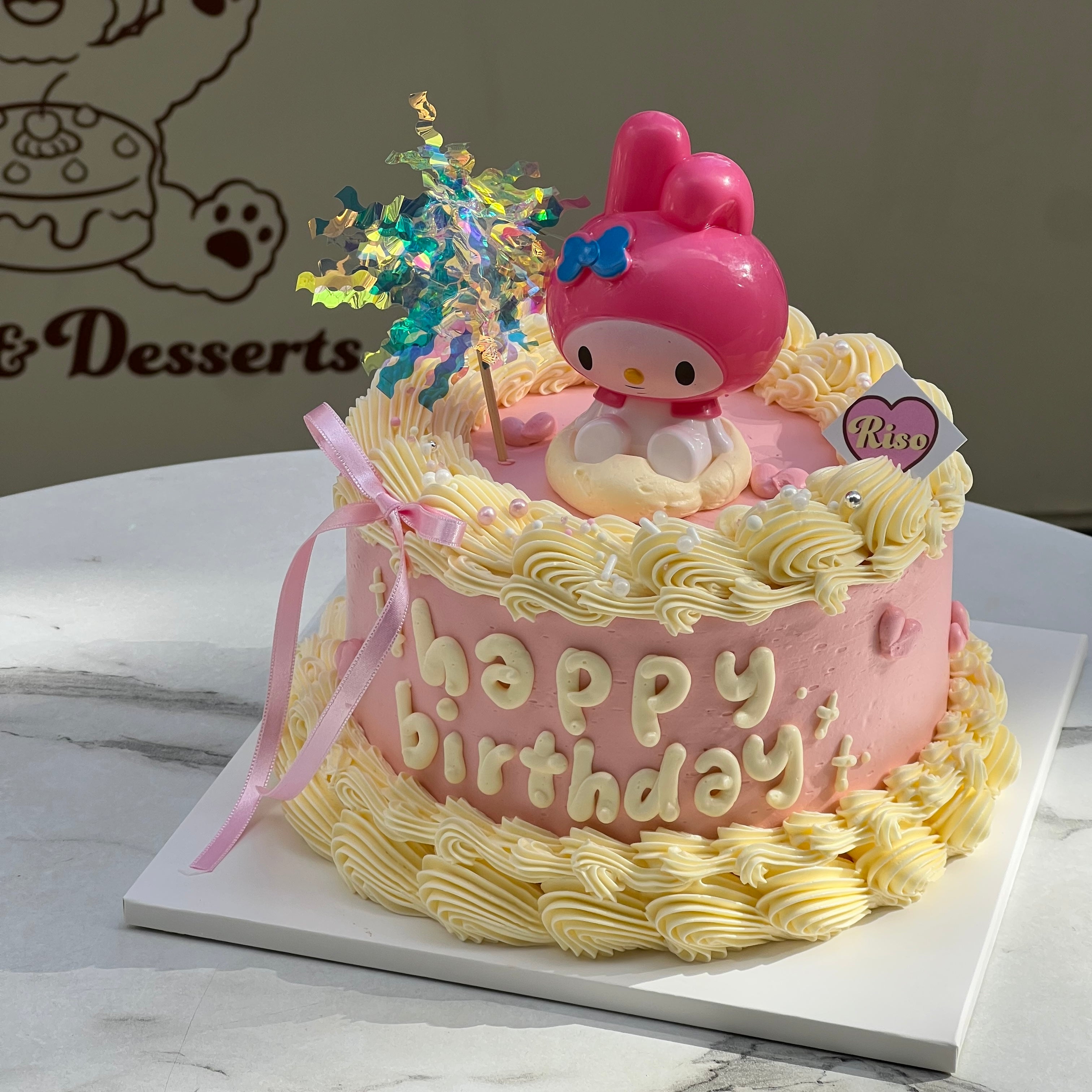A dreamy, pastel-colored birthday cake with a playful 3D My Melody topper and sparkly decoration, full of kawaii charm
