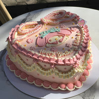 A pink vintage-style cake featuring a My Melody character and large piped ribbon on top, decorated with frilly borders and cream ruffles